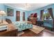 Comfortable bedroom with two windows, wood floors, ceiling fan, and ample natural light at 3485 S Forest St, Denver, CO 80222