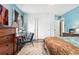 Well-lit bedroom featuring two closets, a work desk, and ample storage at 3485 S Forest St, Denver, CO 80222