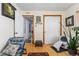 Multipurpose bonus room with lots of storage, wood floors, and easy access to back bedrooms at 3485 S Forest St, Denver, CO 80222