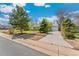 Ranch-style home with well-maintained lawn and a long driveway to a one-car garage at 3485 S Forest St, Denver, CO 80222