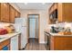 Efficient kitchen featuring wood cabinets, essential appliances, and ample counter space for meal preparation at 3485 S Forest St, Denver, CO 80222