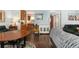 Open-concept living room featuring hardwood floors, natural light, and seamless flow into the adjacent kitchen area at 3485 S Forest St, Denver, CO 80222