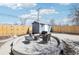 Beautiful backyard with concrete patio, firepit, and privacy fence, great for entertaining at 214 N 10Th Ave, Brighton, CO 80601