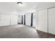 Large finished basement features ample storage and neutral carpet throughout at 214 N 10Th Ave, Brighton, CO 80601