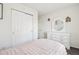 Bright bedroom features a closet with white doors and a vanity with storage drawers at 214 N 10Th Ave, Brighton, CO 80601