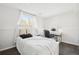 Bright bedroom with a full bed, large window, vanity, and white furniture offering a comfortable space at 214 N 10Th Ave, Brighton, CO 80601