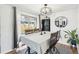 Elegant dining area with natural light, stylish light fixture, and cozy ambiance at 214 N 10Th Ave, Brighton, CO 80601