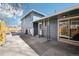 A home's exterior features a well-maintained patio area and mature trees at 214 N 10Th Ave, Brighton, CO 80601