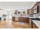 Well-lit kitchen with stainless steel appliances, wood cabinets, and pristine countertops at 214 N 10Th Ave, Brighton, CO 80601