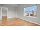 Inviting bedroom with hardwood floors and a window looking out to the city at 1780 N Washington St # 405, Denver, CO 80203