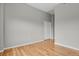 Bedroom featuring hardwood floors, neutral walls, and large closet at 1780 N Washington St # 405, Denver, CO 80203