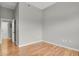 Empty bedroom with hardwood floors, neutral walls, and a closet at 1780 N Washington St # 405, Denver, CO 80203