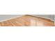 Close up of light, natural hardwood flooring and white baseboards at 1780 N Washington St # 405, Denver, CO 80203