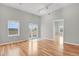 Spacious room with wood floors, neutral walls, and access to a balcony, perfect for relaxing and entertaining at 1780 N Washington St # 405, Denver, CO 80203