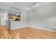 An open living space showcasing wood floors and neutral walls, seamlessly connecting to the kitchen area at 1780 N Washington St # 405, Denver, CO 80203