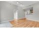 Open concept living area with hardwood flooring, neutral paint, and seamless access to the kitchen at 1780 N Washington St # 405, Denver, CO 80203
