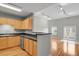 Open floor plan featuring hardwood floors, neutral colors, and natural light, with kitchen view at 1780 N Washington St # 405, Denver, CO 80203