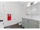 Bathroom featuring tiled floors, updated vanity, and glass shower at 501 Lois Dr, Louisville, CO 80027