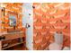 Charming bathroom features stylish crane wallpaper and a walk-in shower with glass door at 501 Lois Dr, Louisville, CO 80027