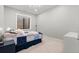 Cozy bedroom with a modern light fixture, window well, and neutral color scheme at 501 Lois Dr, Louisville, CO 80027