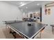 Game room featuring a ping pong table, with a large seating area in the background at 501 Lois Dr, Louisville, CO 80027