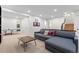 Large living room with sectional sofa, coffee table, and ping pong table at 501 Lois Dr, Louisville, CO 80027