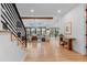 Spacious living room with gleaming hardwood floors and an abundance of natural light at 501 Lois Dr, Louisville, CO 80027