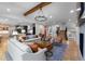 Open-concept living room with hardwood floors, fireplace, and stylish furniture at 501 Lois Dr, Louisville, CO 80027