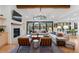 Bright living room featuring a fireplace, stylish seating, and expansive windows at 501 Lois Dr, Louisville, CO 80027