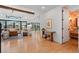 Open-concept living room with hardwood floors and seamless flow to dining area at 501 Lois Dr, Louisville, CO 80027