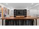 Spacious recreation room featuring a built-in entertainment center and seating for entertainment at 501 Lois Dr, Louisville, CO 80027