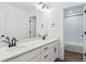 Bathroom featuring double sinks, undermount cabinets, and modern fixtures at 8230 Snake River St, Littleton, CO 80125