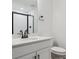 Modern bathroom with white vanity, sleek black fixtures and glass shower at 8230 Snake River St, Littleton, CO 80125