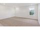 Spacious bedroom features plush carpet, a large window, and ample natural light at 8230 Snake River St, Littleton, CO 80125
