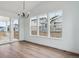 Bright dining area with natural light from sliding glass door and three adjacent windows at 8230 Snake River St, Littleton, CO 80125