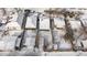 Aerial view of snow covered roofs showing backyard layouts and neighborhood design at 4518 Vallejo St, Denver, CO 80211