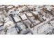 An aerial view of snow-covered residential properties showcasing backyard spaces and neighborhood layout at 4518 Vallejo St, Denver, CO 80211