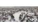 Aerial view of a residential area with snow-covered rooftops and landscapes at 4518 Vallejo St, Denver, CO 80211