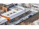 Commercial building featuring brick facade, snowy rooftop, and parking along a snow-covered street at 4518 Vallejo St, Denver, CO 80211