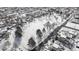 Panoramic aerial view of a snow-covered neighborhood showcasing residential homes and city streets at 4518 Vallejo St, Denver, CO 80211