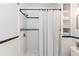 Classic bathroom featuring white subway tile, black accents, and built-in shelving at 4518 Vallejo St, Denver, CO 80211