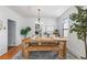 Bright dining room featuring a wooden table and bench, setting a rustic yet elegant tone at 4518 Vallejo St, Denver, CO 80211