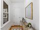 Bright foyer with a stylish mirror, wooden table, and natural light at 4518 Vallejo St, Denver, CO 80211