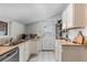 Functional kitchen features ample counter space, white cabinetry, and practical design, ready for your culinary adventures at 4518 Vallejo St, Denver, CO 80211