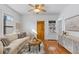 Bright living room with stylish decor, a comfortable sofa, and hardwood floors at 4518 Vallejo St, Denver, CO 80211