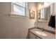 Half bath featuring modern fixtures, neutral colors, and an oval sink at 190 Olympia Ave, Longmont, CO 80504