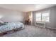 Bright bedroom with a large window that provides natural light at 190 Olympia Ave, Longmont, CO 80504