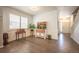 Bright dining room with hardwood floors, wainscoting, and a window with shutters at 190 Olympia Ave, Longmont, CO 80504