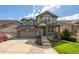 Inviting two-story home with a covered porch, showcasing a well-maintained lawn and attractive landscaping at 190 Olympia Ave, Longmont, CO 80504