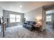 Comfortable living room with a window and neutral carpet at 190 Olympia Ave, Longmont, CO 80504